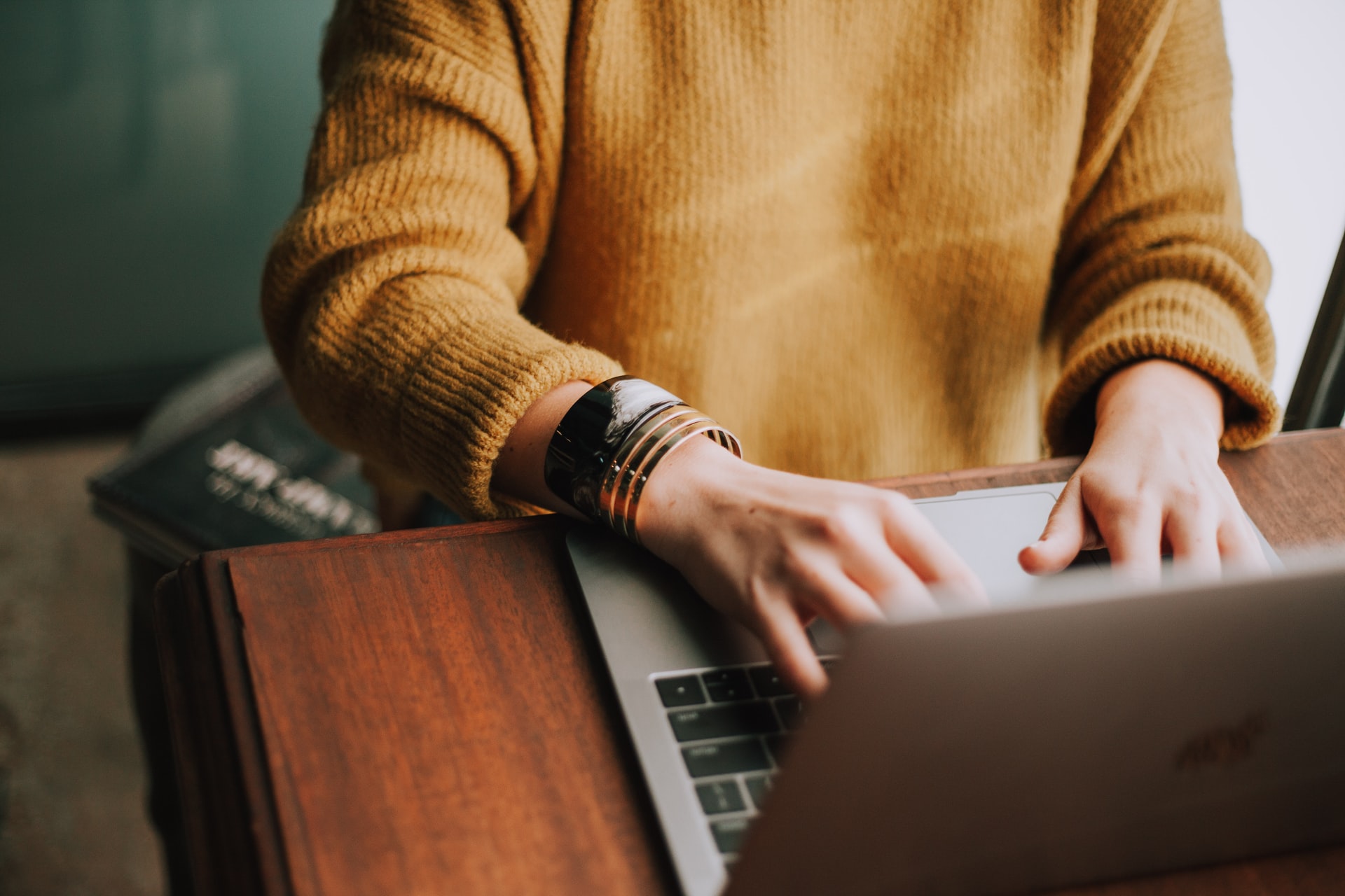 women working at a laptop