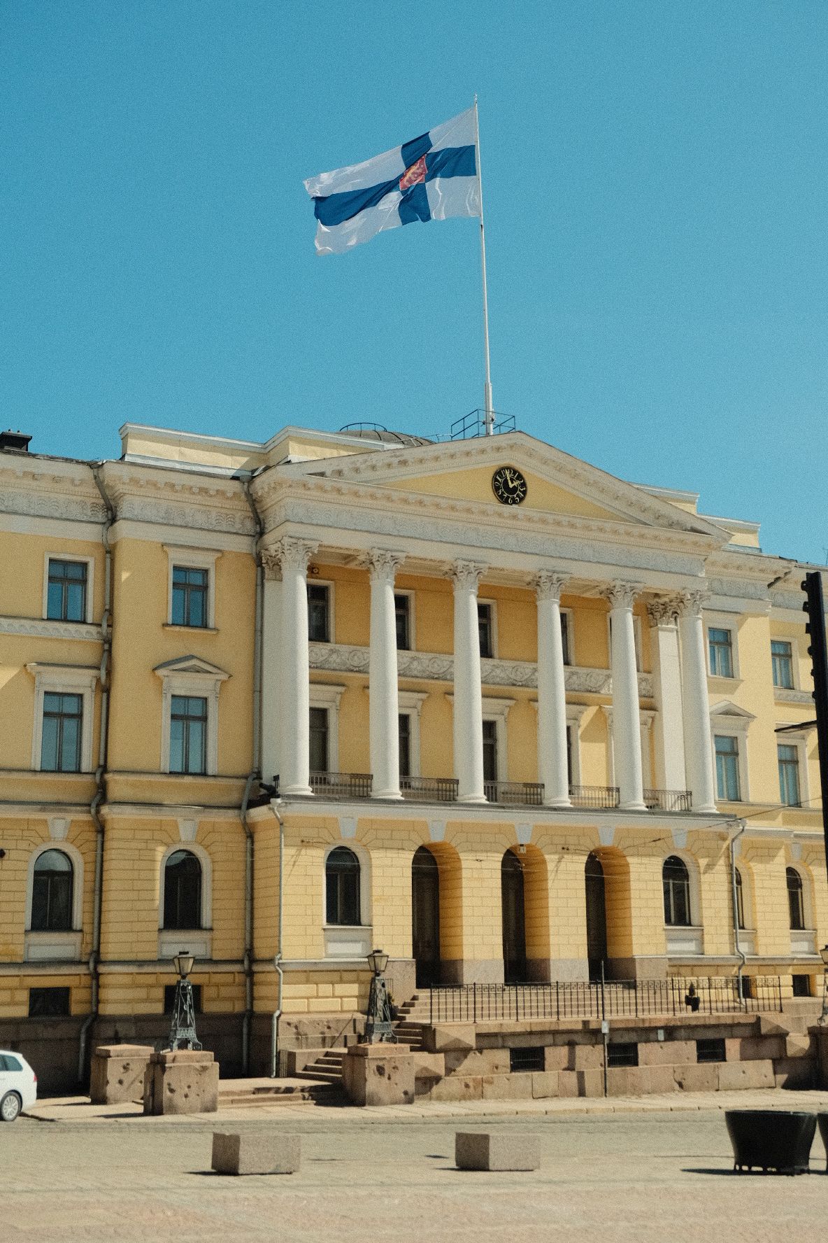 yellow building with finnish flag